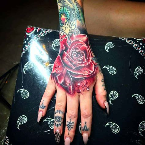 roses on hand tattoo|rose tattoo on hand woman.